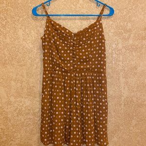 Gold romper with white flowers